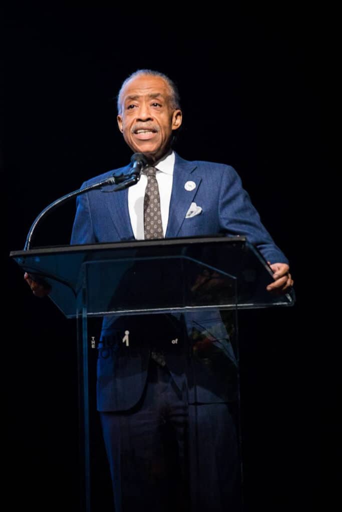 Man speaking at podium during event
